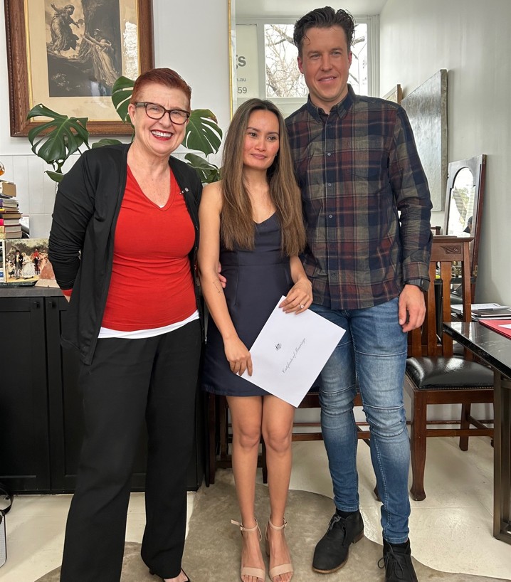 Couple holding wedding certificate
