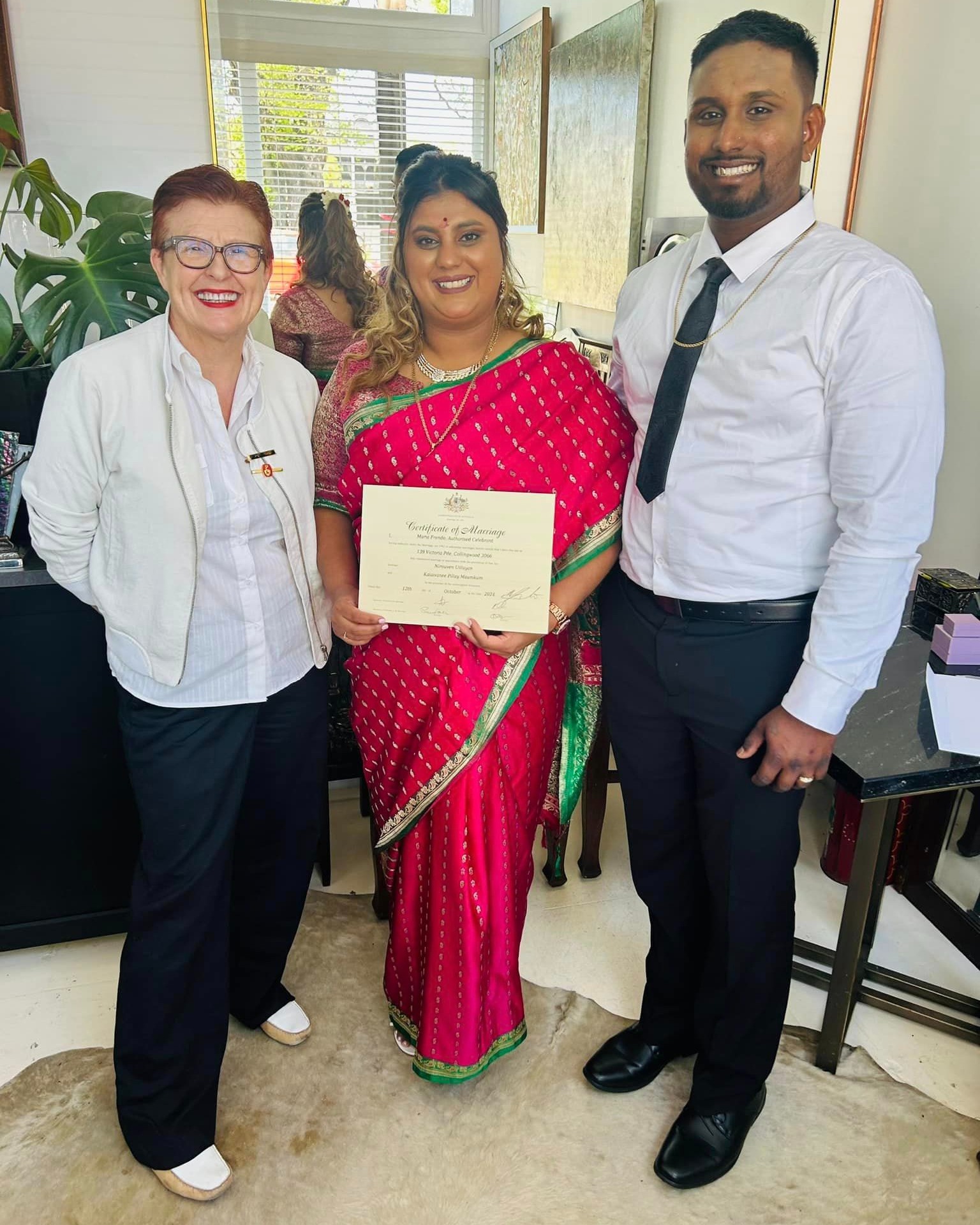 Couple holding wedding certificate